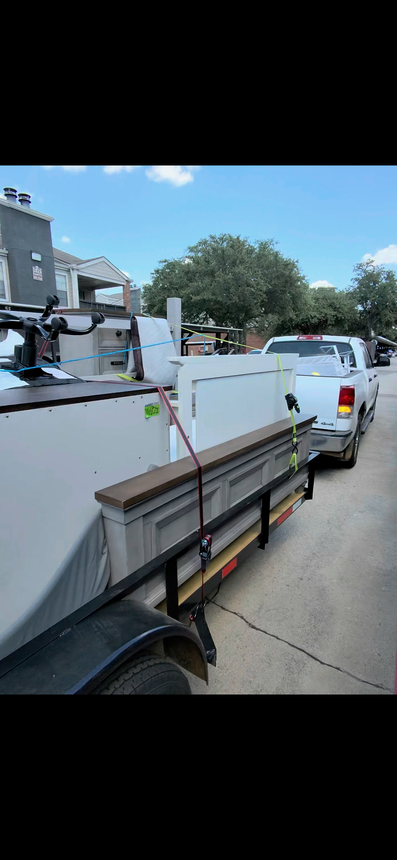 Side view of furniture loaded behind the hauling truck